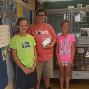 Dalanie Acklin and Brylin Jones presented Wendy Combs, animal shelter director, with $244. The girls raised the funds in one day by selling lemonade and cookies door-to-door in Barnard.