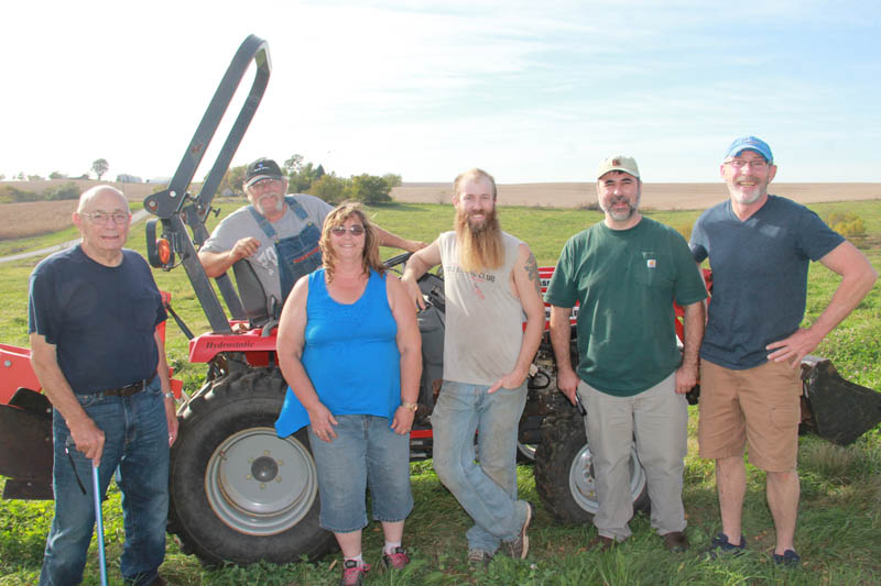 Don Hollingsworth stands with the crew breaking ground at the new location of Hollingsworth Peonies. They are Bob and Melinda Stevens, Cody Johnson, Juergen Steininger and Tim Bouffard. Steininger and Bouffard are partners in the new venture located at 18411 220th Street, Skidmore.