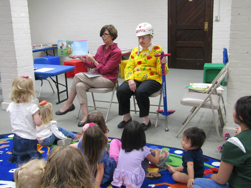 Children listen as author Paula Savaiano and her mother Jeanie Moyer “Gramma” read a story at the Maryville Public Library.