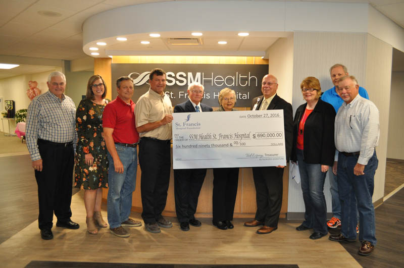 St. Francis Hospital Foundation Board of Directors present SSM Health St. Francis Hospital President Mike Baumgartner, fourth from right, with a check to support technology upgrades and equipment purchases. Attending the check presentation were Foundation board members Jim Jacoby, Megan Jennings, Roger Baker, Brock Pfost, Bill Whited, Donna Holt, Baumgartner, Kay Wilson, Ted Espey and John Baker.