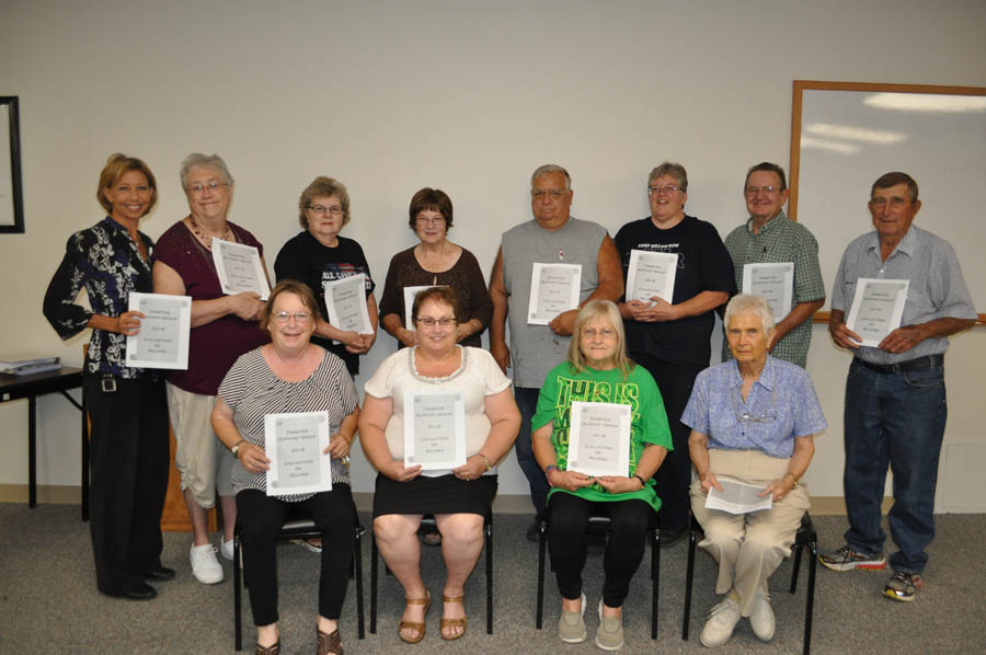 Diabetes Support Group members with their new cookbook are front: Charlotte Dunn, Linda Welch, Anna Roberts and Pat Robbins, and back: Debra Hull, group leader, Karen Fugate, Susan Maxwell, Kathleen Stiens, Tom Spire, Darlene Farmer, Larry Dawson and Jim Boyles.